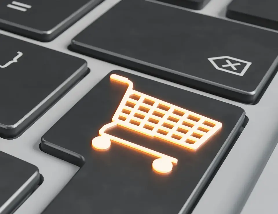a keyboard with a lit up shopping cart button
