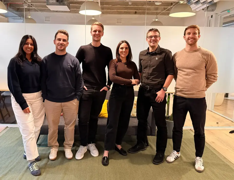 a group of people posing for a photo