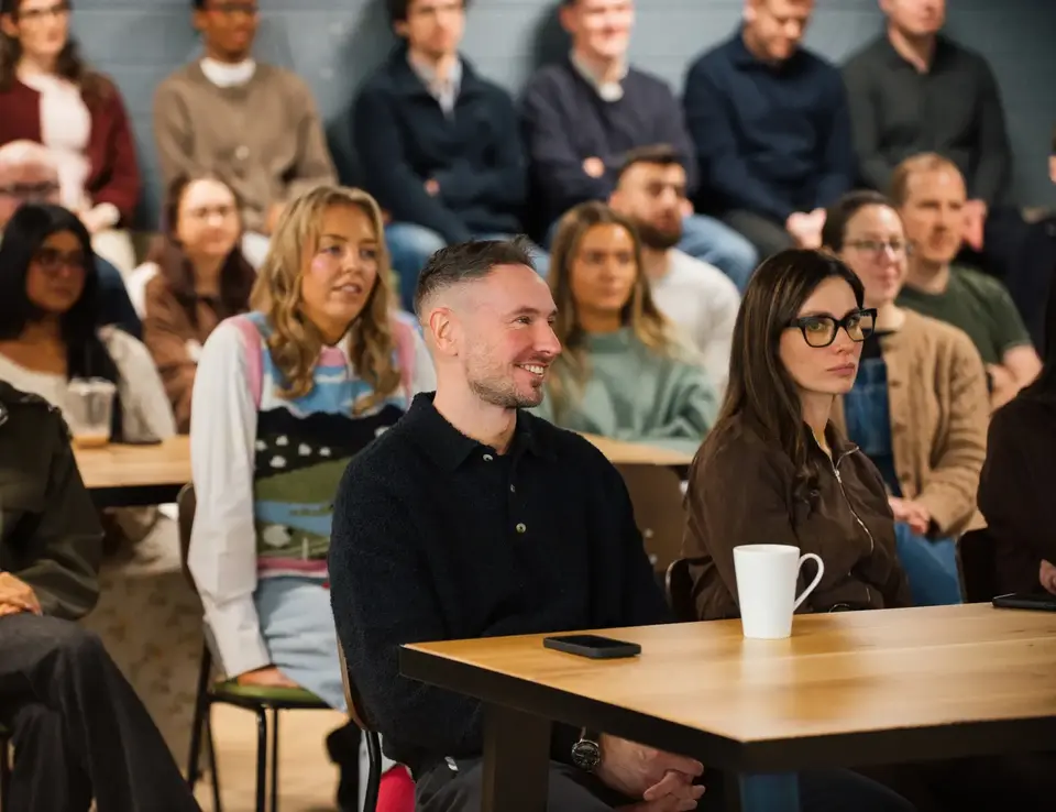 a group of people sitting at a table