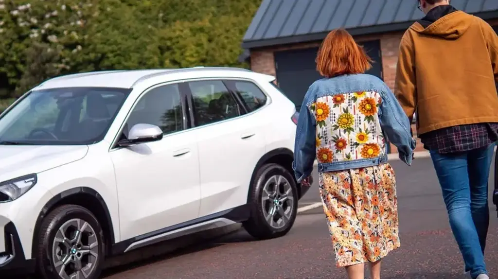 a man and woman walking down the street