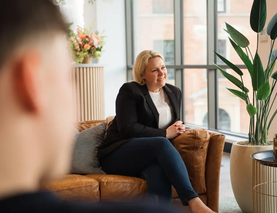 a woman sitting on a couch