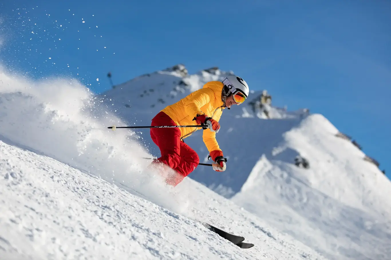 a person skiing down a snowy hill