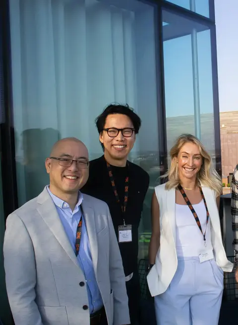 a group of people posing for a photo