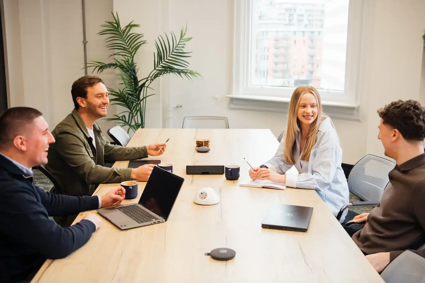 a group of people sitting around a table