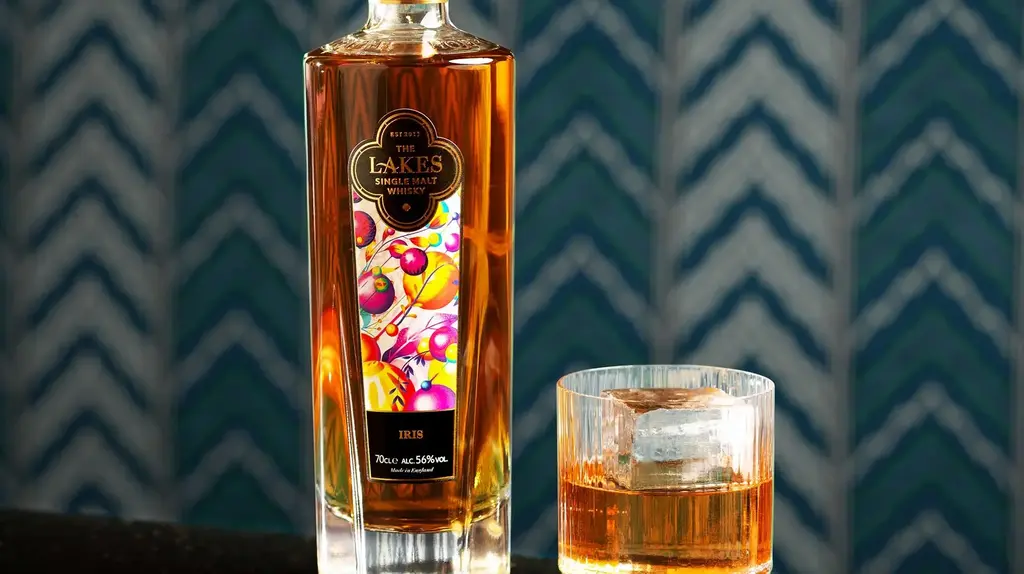 a bottle of alcohol next to a glass of liquid