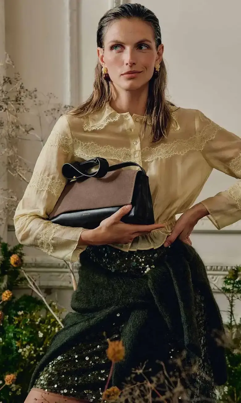 a woman holding a purse
