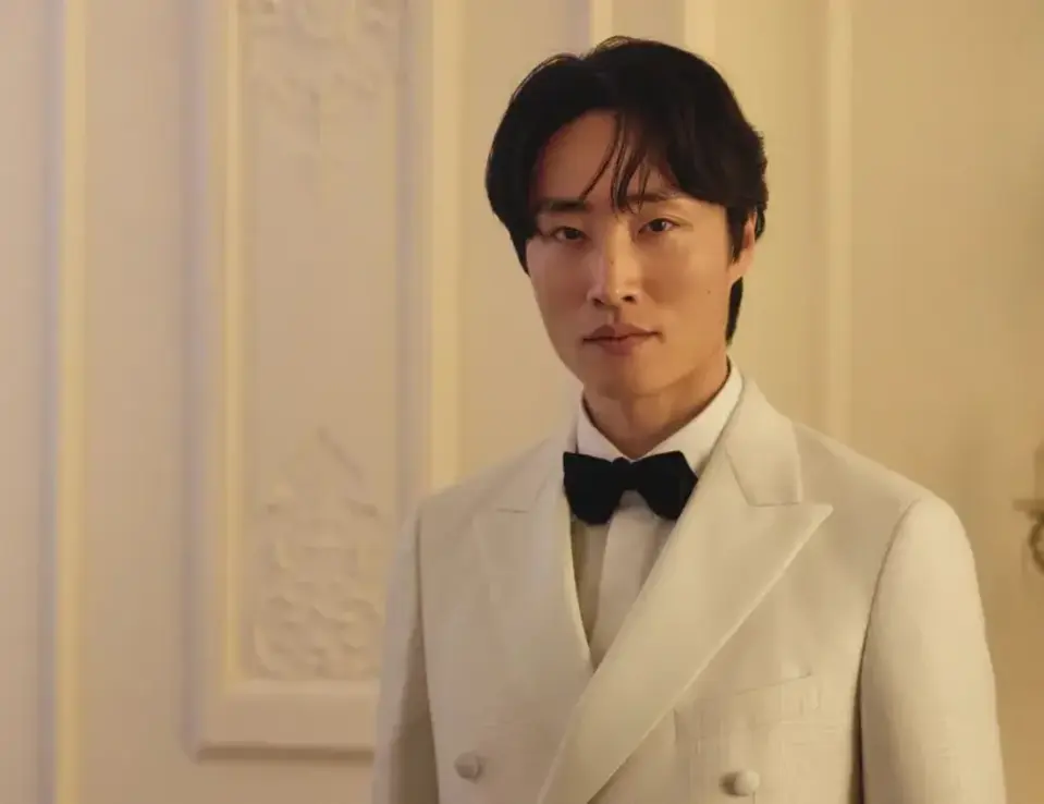 Young man standing in a white tuxedo