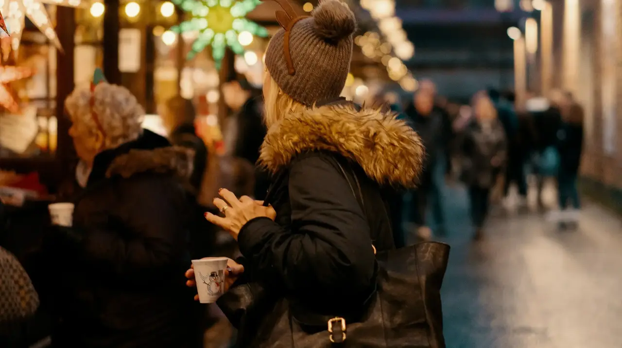 Woman shopping at a Christmas market 