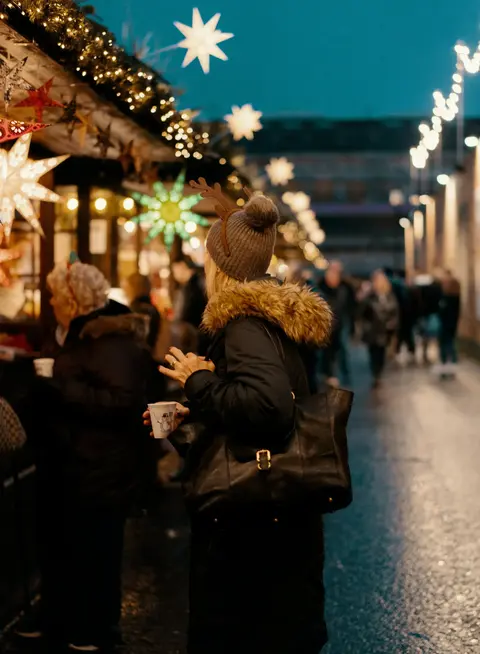 Woman shopping at a Christmas market