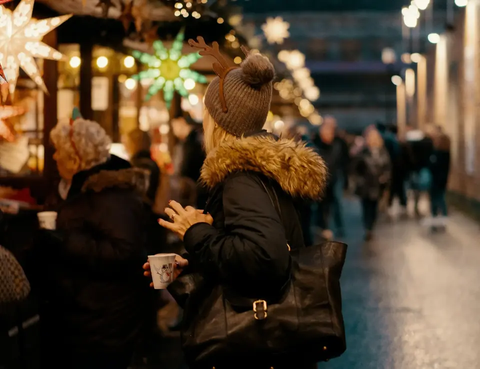 Woman shopping at a Christmas market