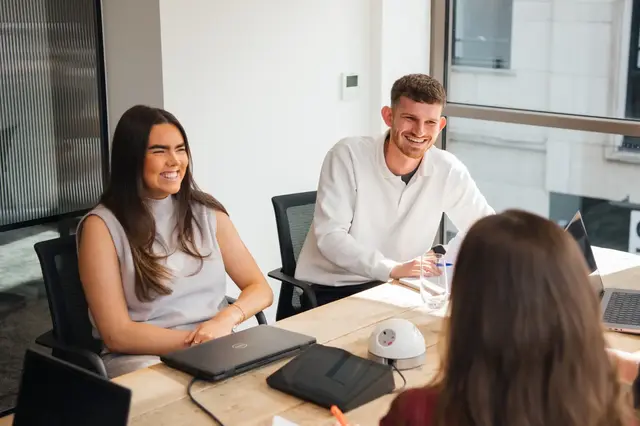 a group of people sitting at a table