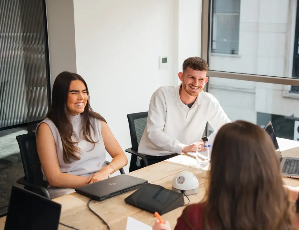a group of people sitting at a table