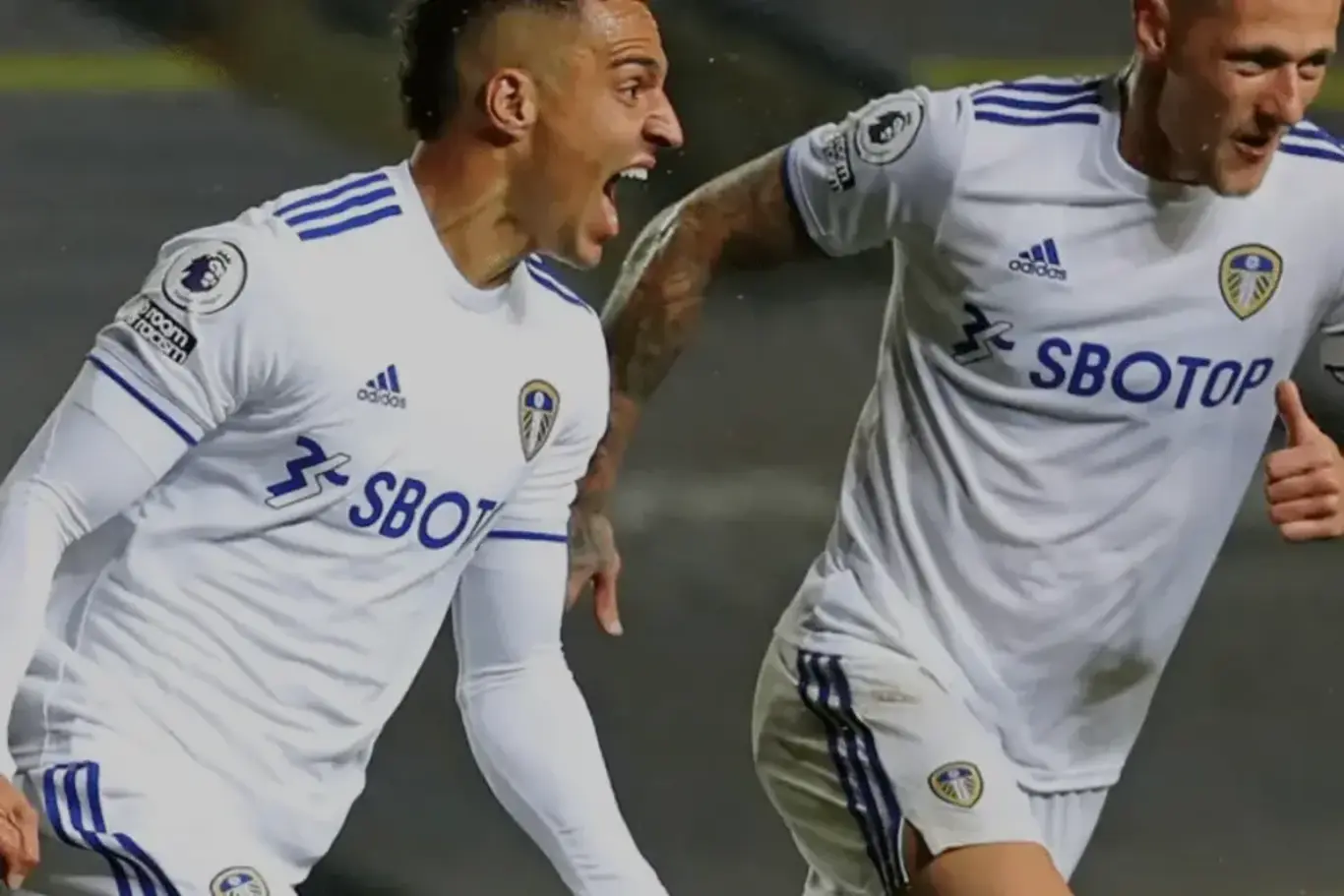 two men in sports uniforms