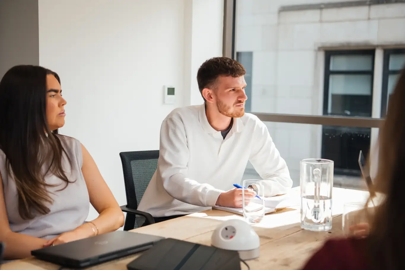 IDHL employees in a meeting