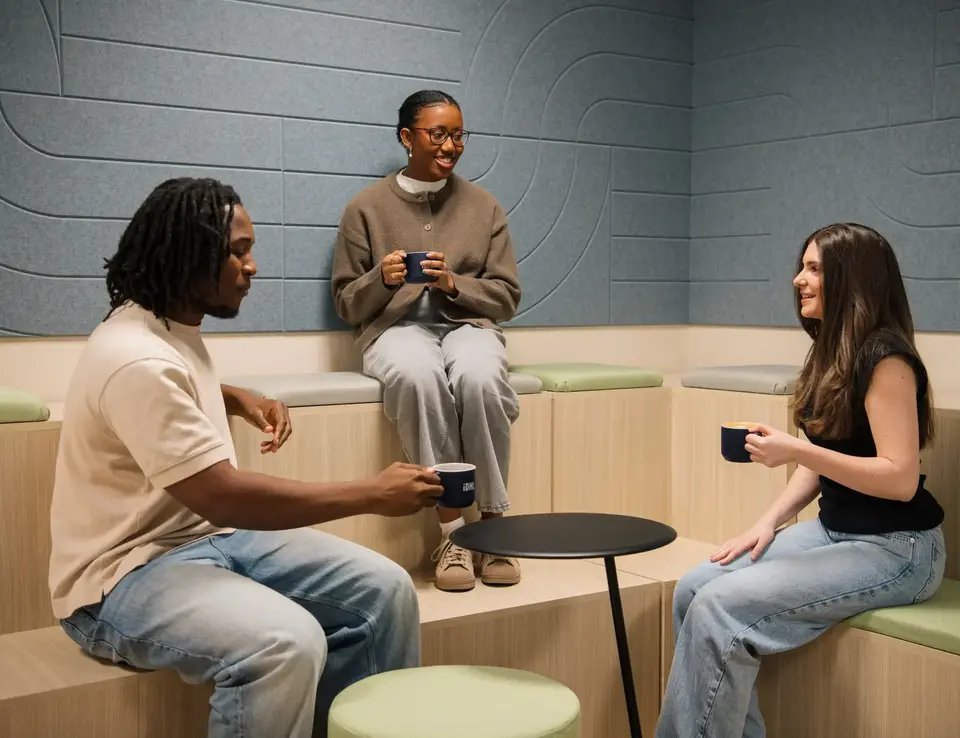 a group of people sitting on a bench
