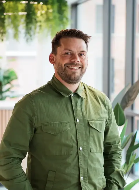 a man in green shirt