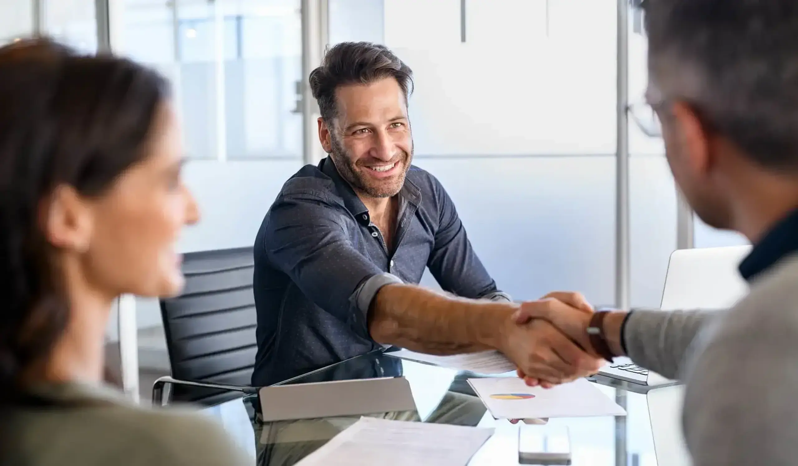 a man shaking hands with another man