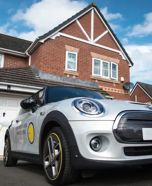 a car parked in front of a house