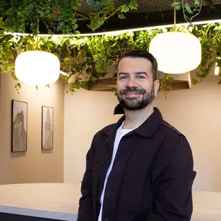 a man standing in front of a counter