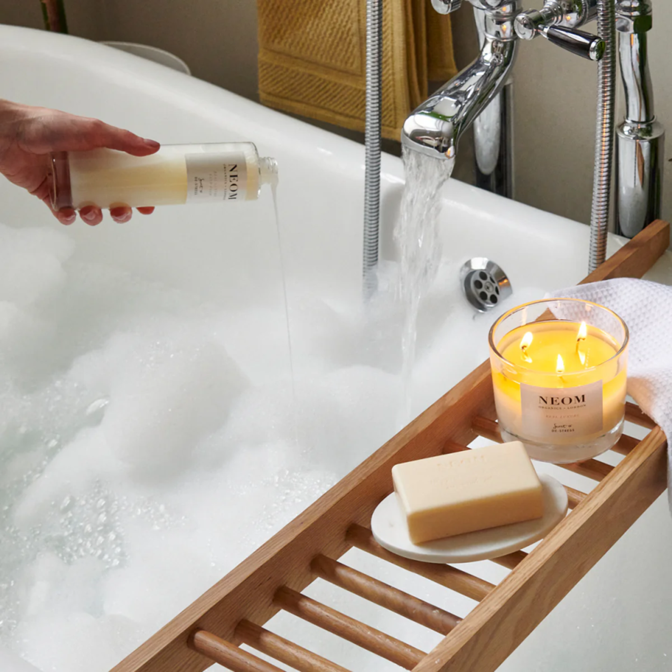 NEOM (IDHL client) image showing a bath table holding a candle