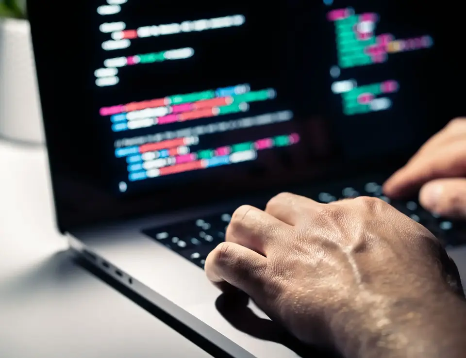 a hand on a keyboard