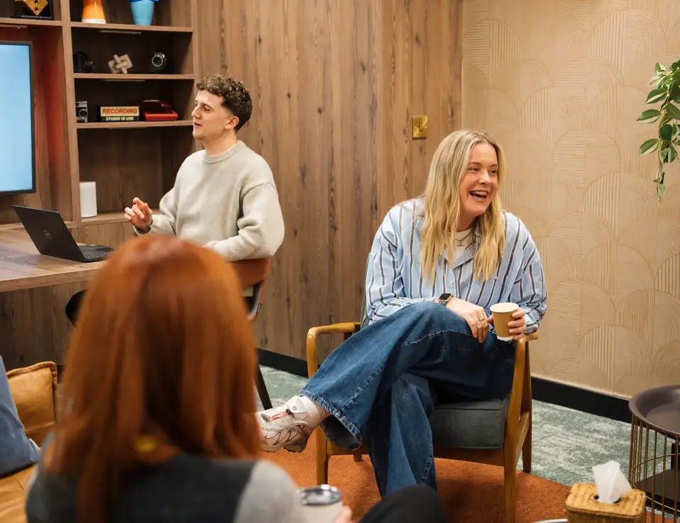 a group of people sitting in chairs
