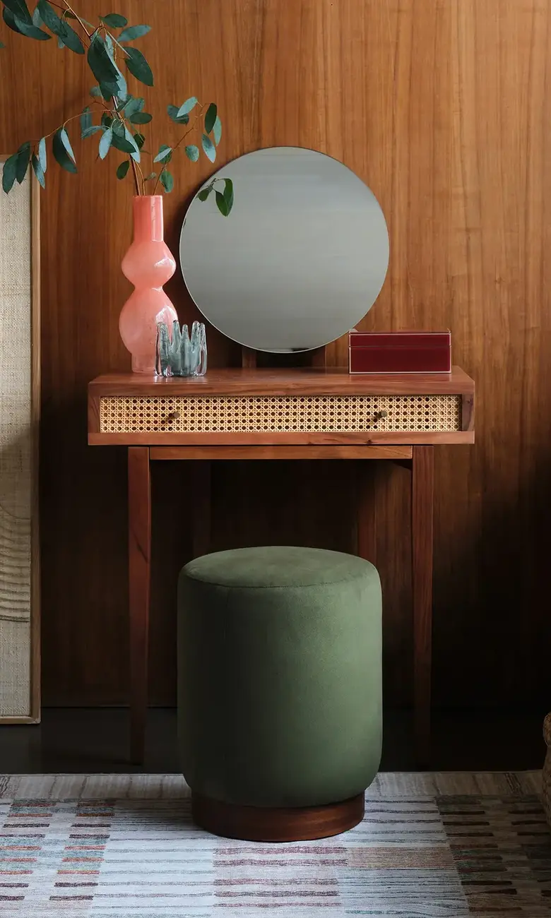 a round mirror on a table