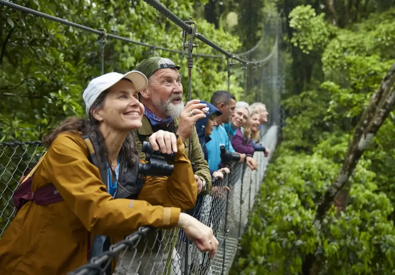 a group of people looking through binoculars