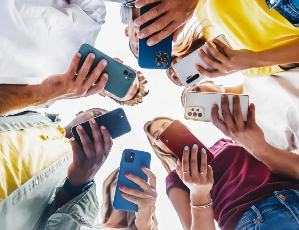 a group of people holding cell phones