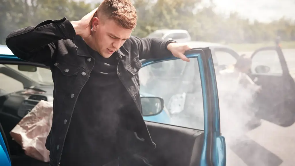 a man looking out of a car door
