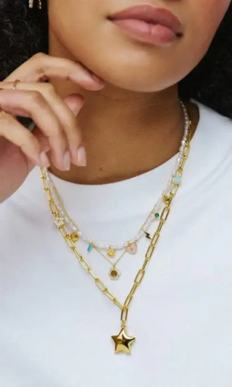 Gold chains and bracelets on model