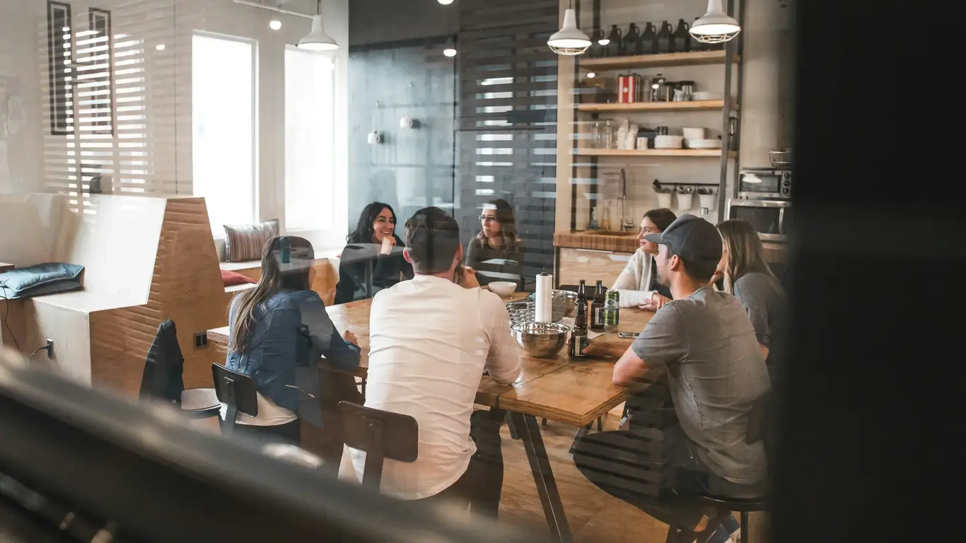 a group of people sitting around a table