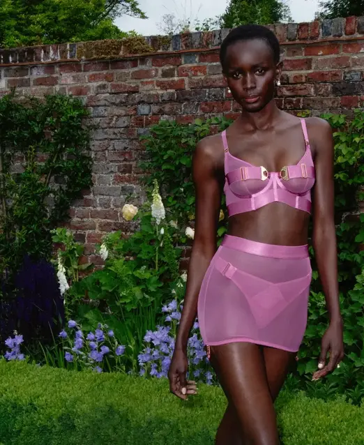 a woman in pink lingerie
