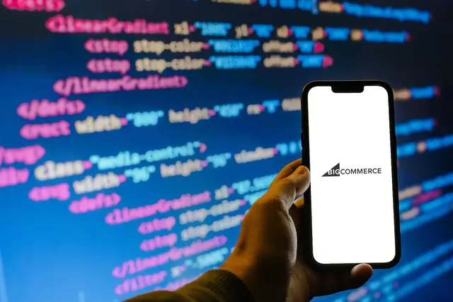 a hand holding a phone with a screen on it
