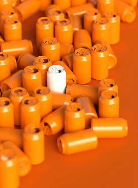 a group of orange soda cans