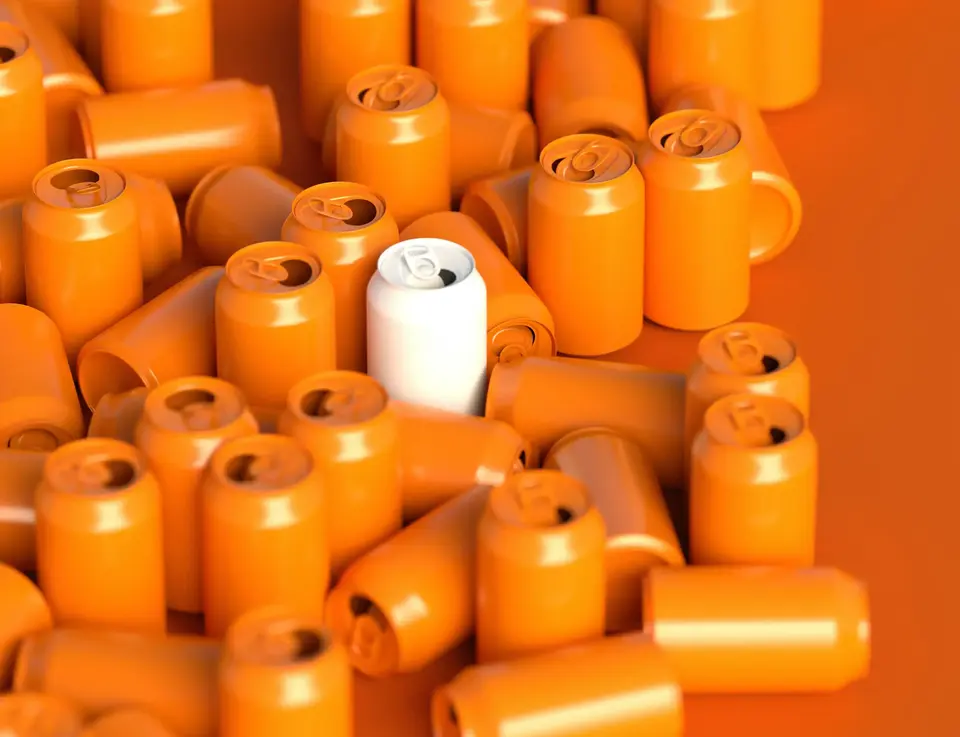 a group of orange soda cans