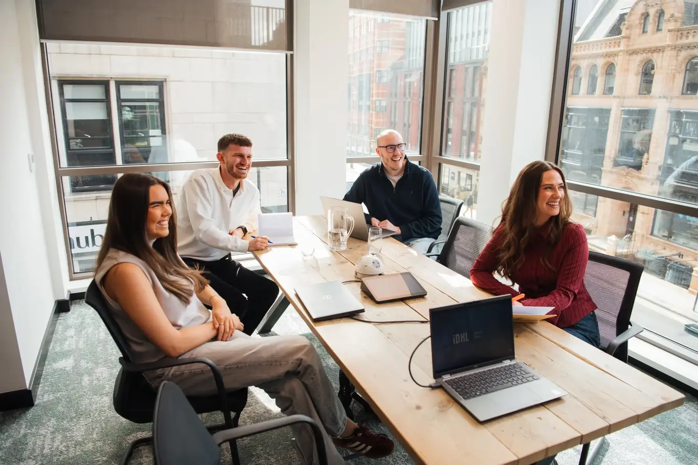 IDHL employees in a meeting