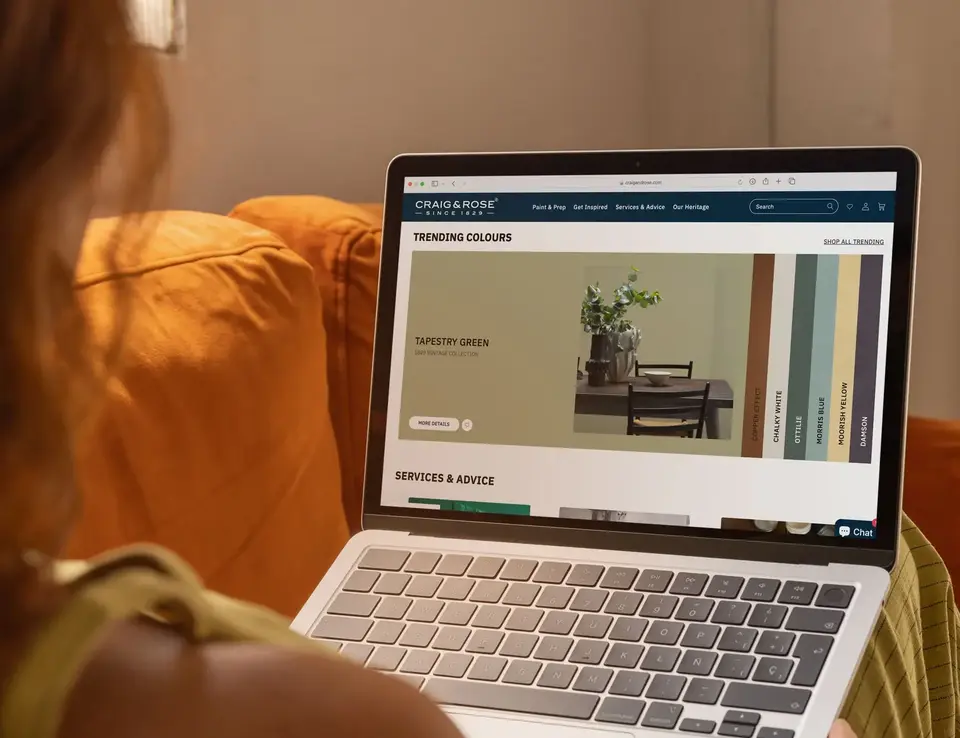 a person holding a laptop