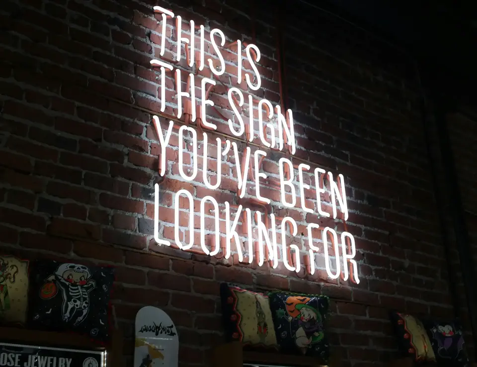 a sign on a brick wall