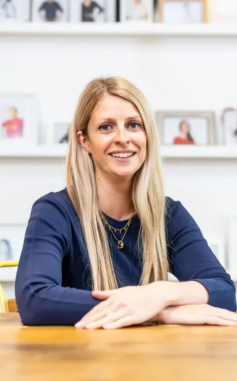 a woman sitting at a table