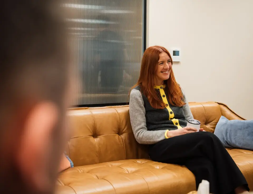 a woman sitting on a couch