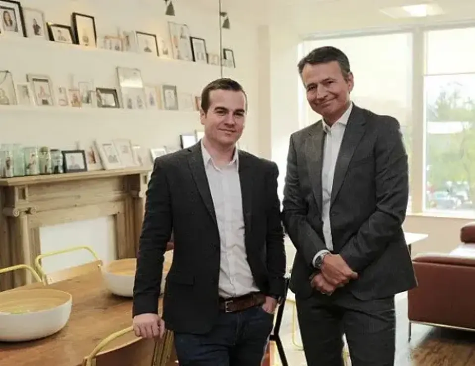 two men standing next to each other