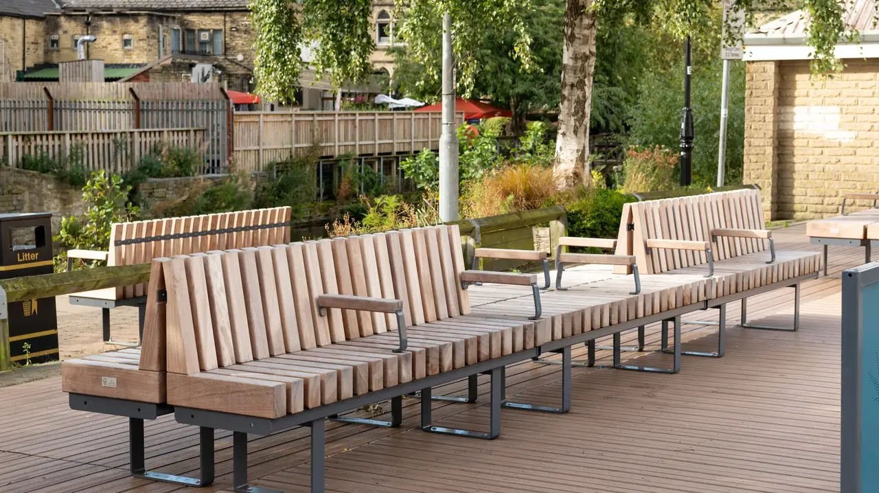 a row of wooden benches on a deck
